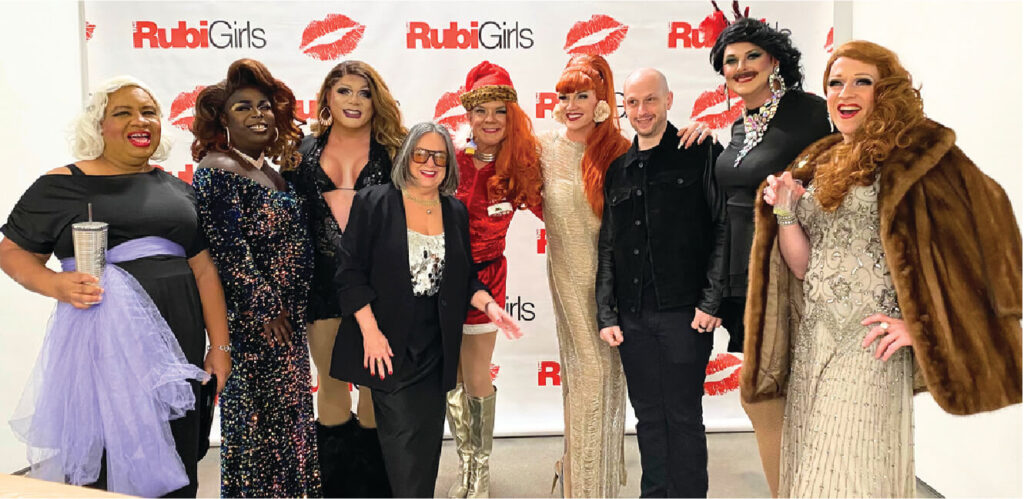 Group photo of rubi girls, tyler back, and eva