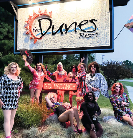 Rubi Girls in front of the Dunes Resort sign