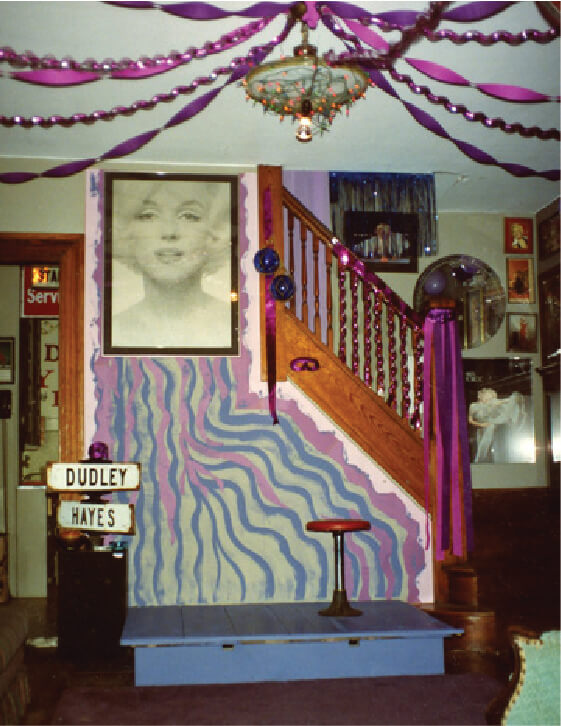 homemade stage in a living room with a marylin monroe poster